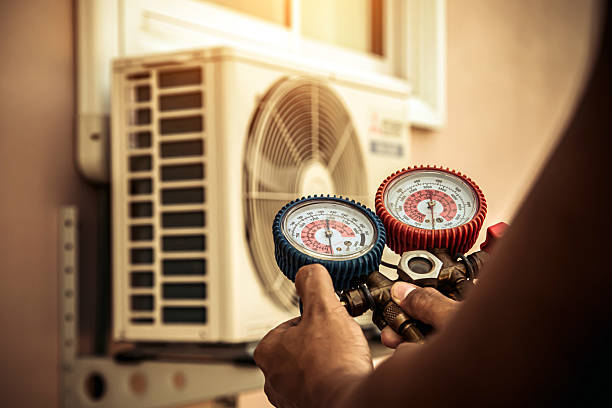 Professional Air Conditioning Service technician working in Logan, OH